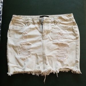 Light wash frayed bottom jean skirt